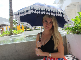 Luxury Umbrella Company Presents a Modern Parasol Offering a Stylish Way to Shade Yourself.